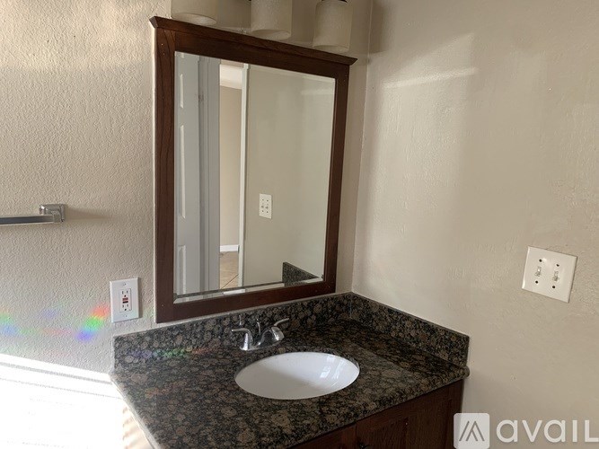 A bathroom sink with a mirror above it.