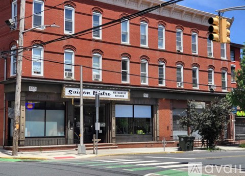 A red brick building with a sign that says "SALON BISTRO RESTAURANT".