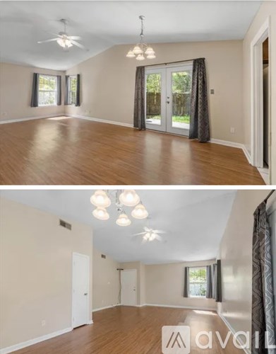 A living room with a ceiling fan and a dining area with a table and chairs.