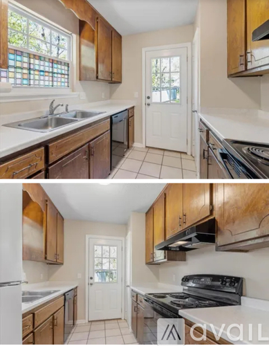 A kitchen with wooden cabinets and a white door.