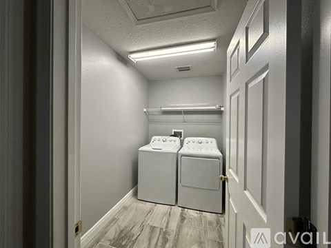 A laundry room with a washer and dryer.