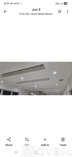 A screenshot of a phone showing a photo of a ceiling with lights.