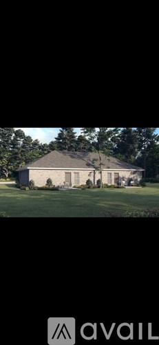 A house with a large lawn in front of it.