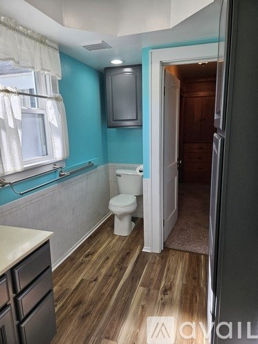 A small bathroom with a toilet and a sink.