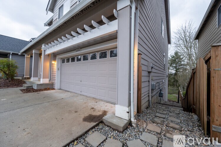 A house with a garage and a driveway.