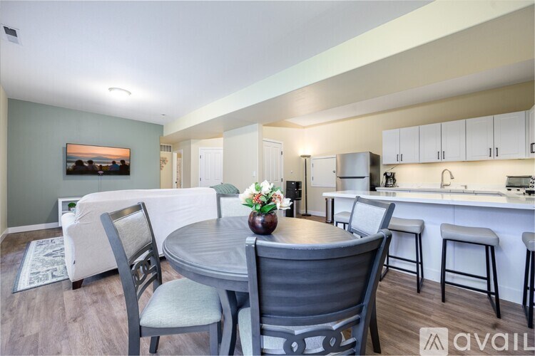 A dining area with a table and chairs is shown.