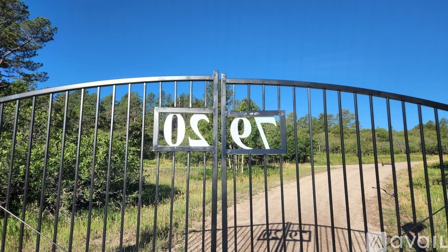 A gate with a sign that reads "OSQ" is blocking the way.