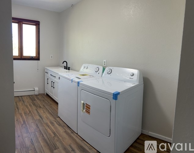 A laundry room with a washer and dryer.