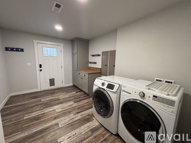 A laundry room with a washer and dryer.