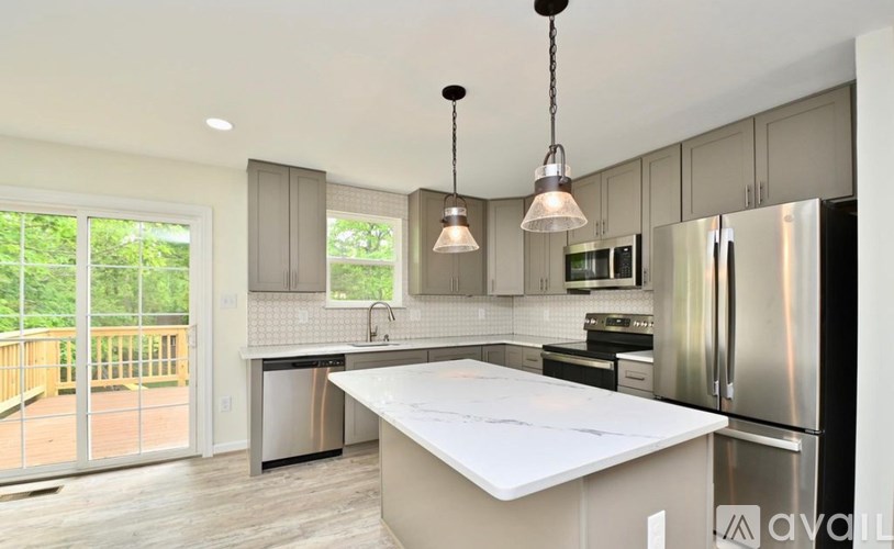 A modern kitchen with a large island in the center.
