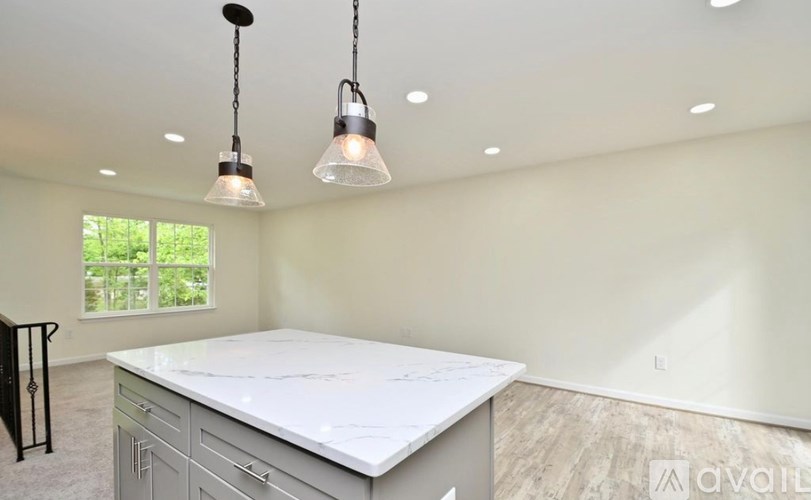 A kitchen with a countertop and cabinets is under construction.