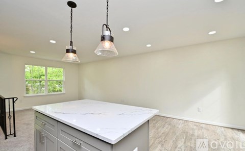 A kitchen with a countertop and cabinets is under construction.