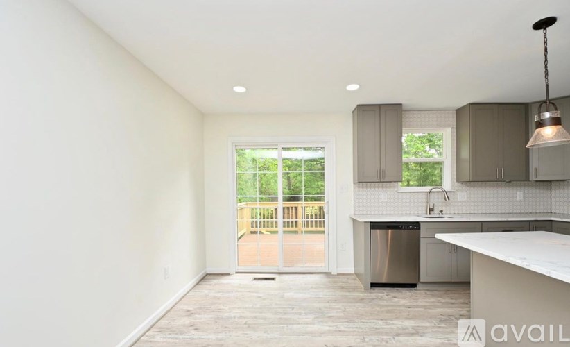 A kitchen with a sink and a window.