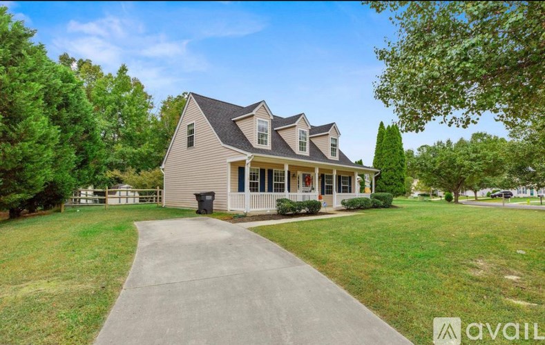 A house with a driveway in front of it.
