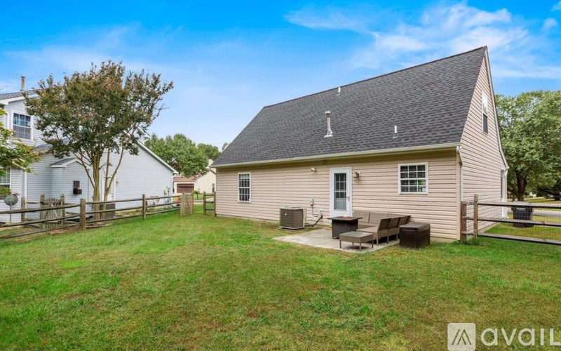 A house with a lawn in front of it is for sale.