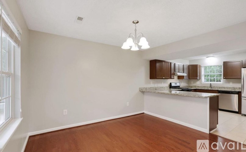 A kitchen area with a counter and cabinets.