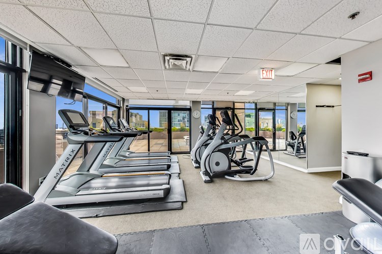 A gym with treadmills and exercise bikes.