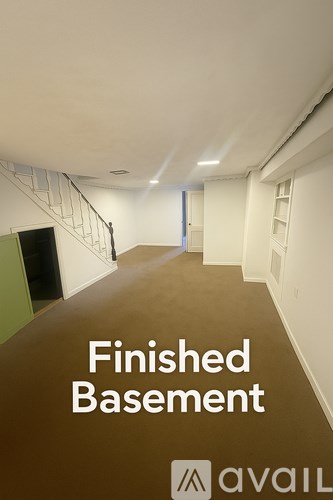 A long hallway with the words "Finished Basement" written on the floor.