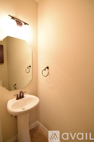 A bathroom with a sink and mirror.