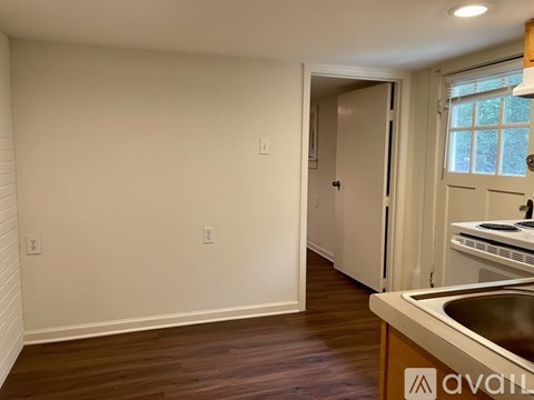 A kitchen area with a sink and a window.
