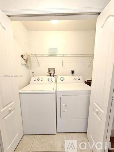 A white bathroom with two sinks and a toilet.