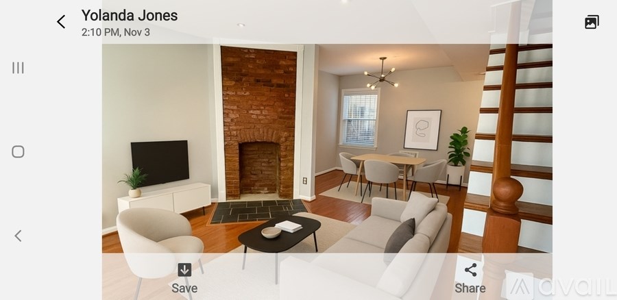 A living room with a fireplace and a TV.
