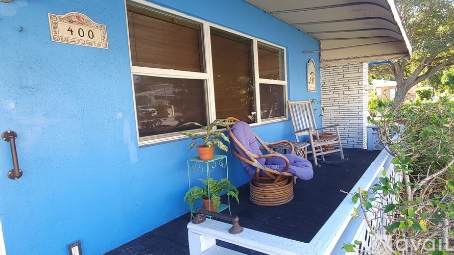 A blue house with a sign that says 400 on it.