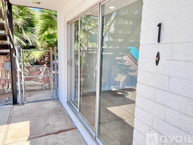 A glass door with a handle is on the right side of the image.