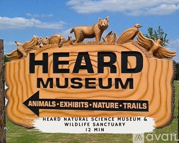 A sign for the Heard Museum featuring animals and nature.