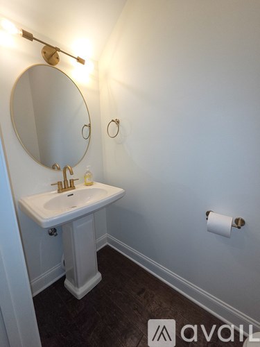 A bathroom with a sink and mirror.