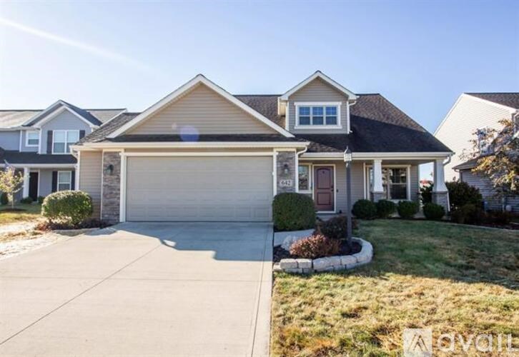 A house with a garage is for sale.