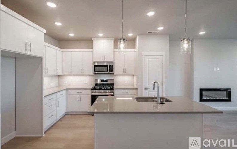 Two front load washing machines in a laundry room.