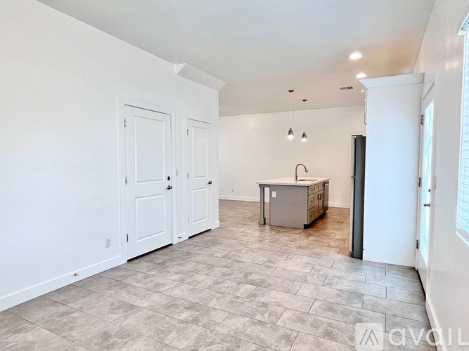 A kitchen area with a sink and a countertop.