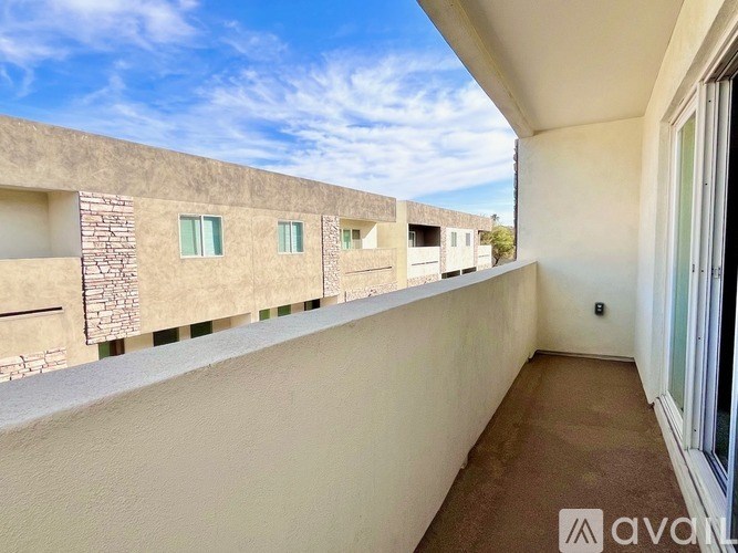 A balcony with a view of a row of houses.