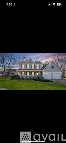 A house with a white exterior and a large front yard.