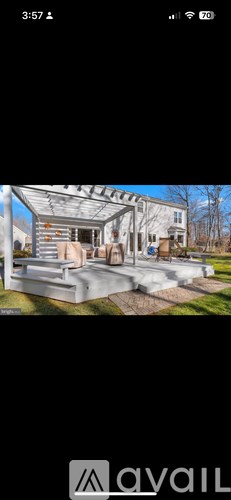 A modern house with a large covered patio area.