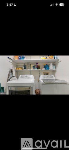 A white shelf with various items on it.