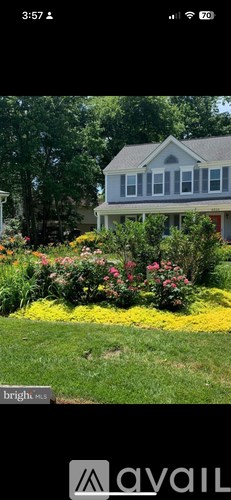A house with a garden in front of it.