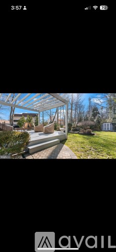 A modern house with a glass roof and a wooden deck.