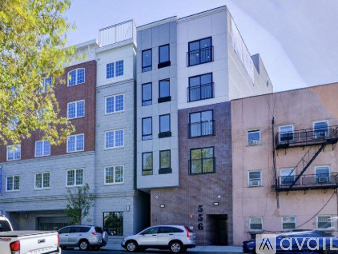 A building with a sign that says "available" in front of it.