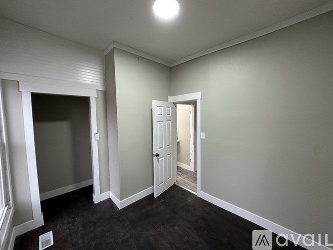 A room with a door and a window.