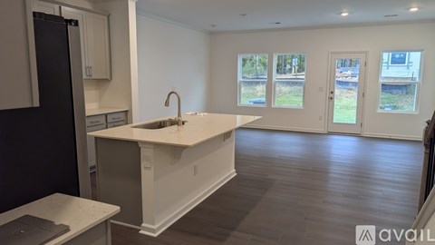 A kitchen with a sink and a window.