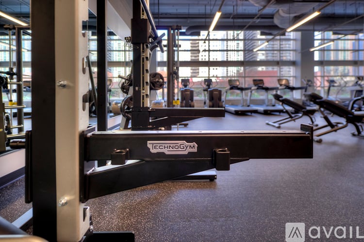 A close up of a weight bench with the brand name ECHOGYM visible.