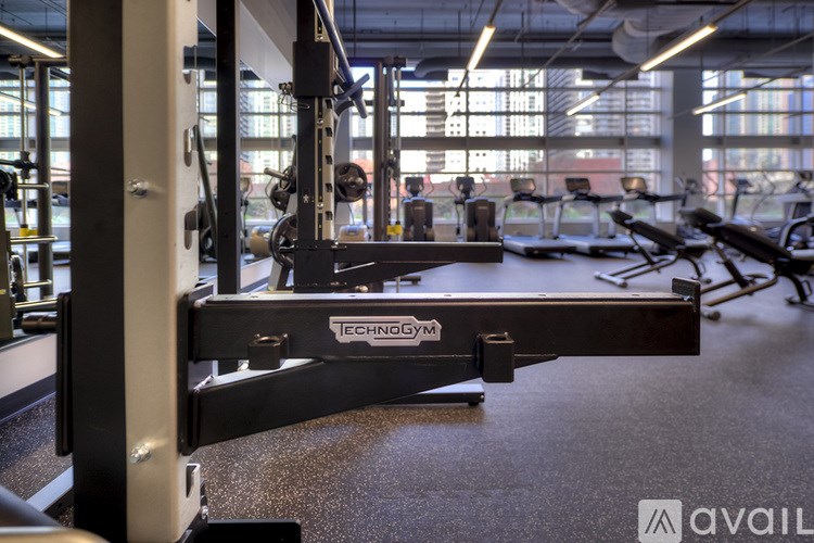 A close up of a weight bench with the brand name ECHOGYM visible.