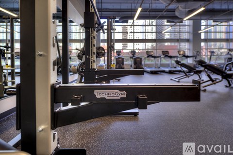 A close up of a weight bench with the brand name ECHOGYM visible.