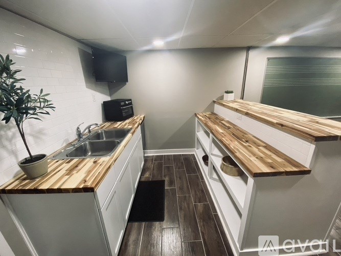 A small kitchen with a sink and a counter.