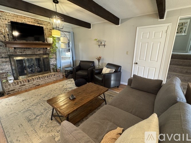 A living room with a fireplace and a couch.