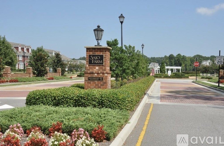 A street view of Sajo Farm with a sign and a lamp post.
