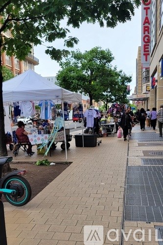 A Target store is visible in the background of a busy sidewalk scene.