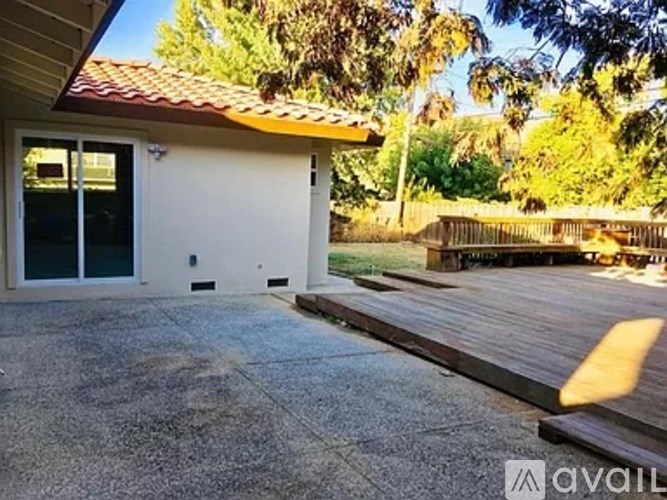 A house with a red tile roof and a white garage door.